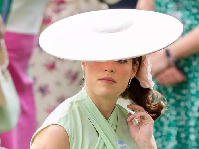 Princess Eugenie wore a mint-green Diane von Furstenberg look on the first day of Royal Ascot with a saucer-shaped fascinator. 