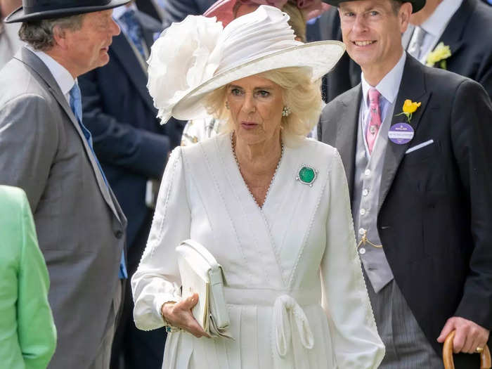 Meanwhile, Camilla opted for an all-white ensemble, complete with an emerald brooch. 