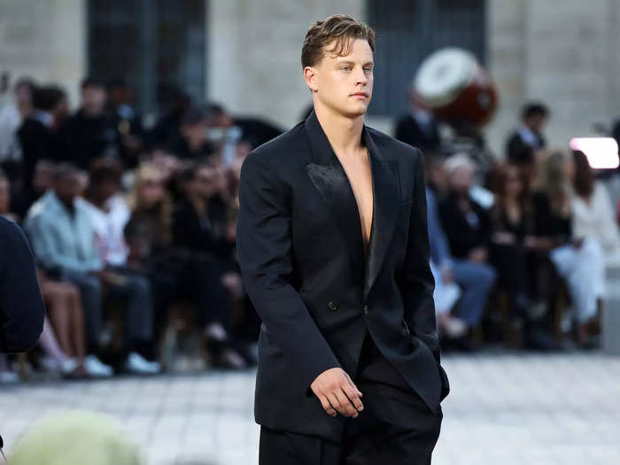 NFL player Joe Burrow also took to the Vogue stage, making his runway debut in a black suit from Peter Do that he wore with no shirt.