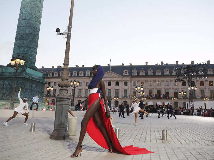 Anok Yai walked the unconventional runway in a red, white, and blue dress from Alaïa that nodded to the French flag. Pieter Mulier reimagined the original Alaïa dress from 1989.
