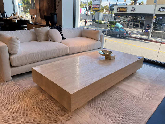 The Enyo travertine coffee table is a timeless and dramatic statement piece.