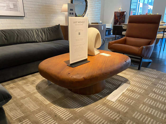 Use the Derrico acacia-wood coffee table to add visual interest to a living room. 