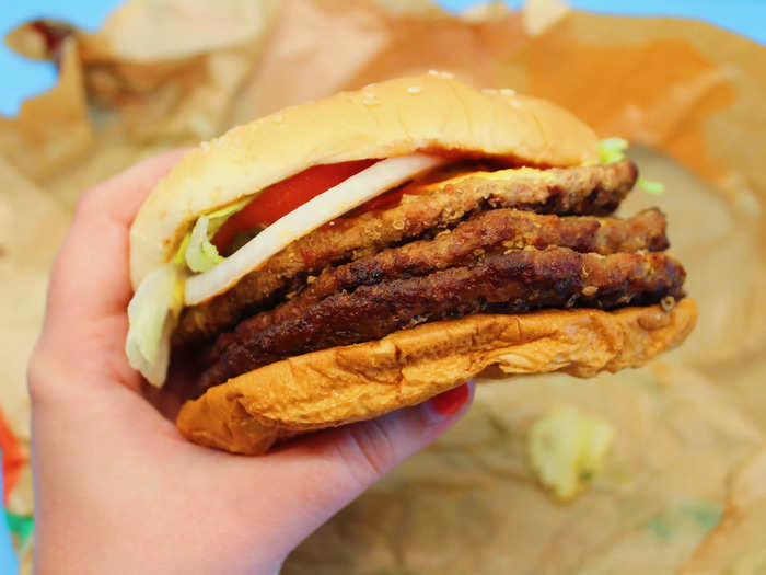 The Triple Whopper comes with three quarter-pound beef patties, one slice of cheese, lettuce, tomatoes, onions, pickles, mayonnaise, and ketchup.