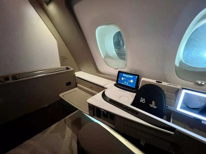 A small vanity sits along the fuselage and includes a mirror and toiletries.