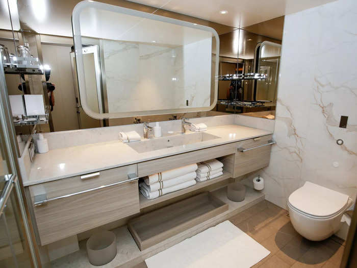 The sleek bathroom was located down a short hall, closer to the front door.