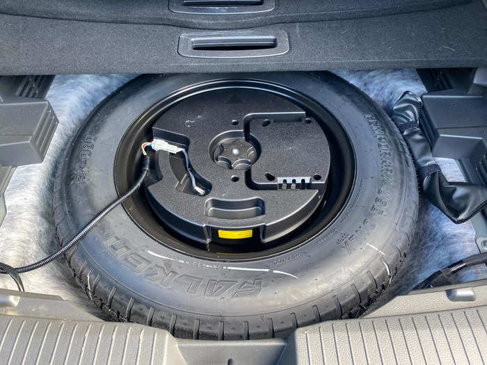 Under the rear cargo floor is a spare tire and the subwoofer for the Rogue