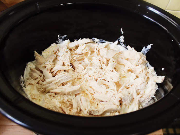 I then added a layer of shredded chicken to the slow cooker.