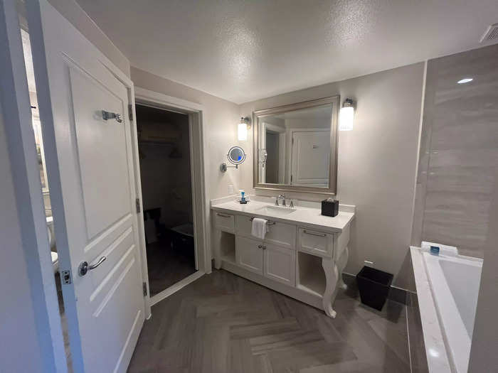 Half of the bathroom is connected to the main bedroom. 