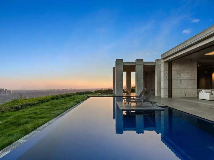 The central lounge area overlooks a massive infinity pool.