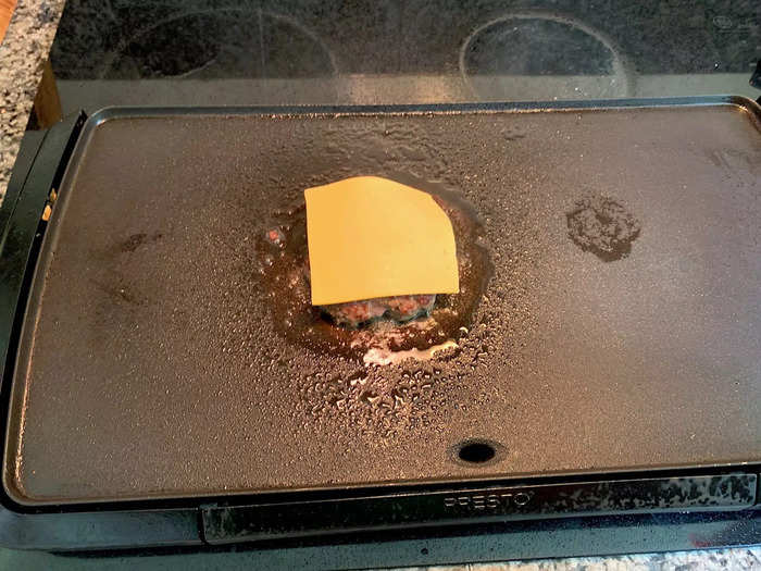 After flipping my patty, I added the cheese.