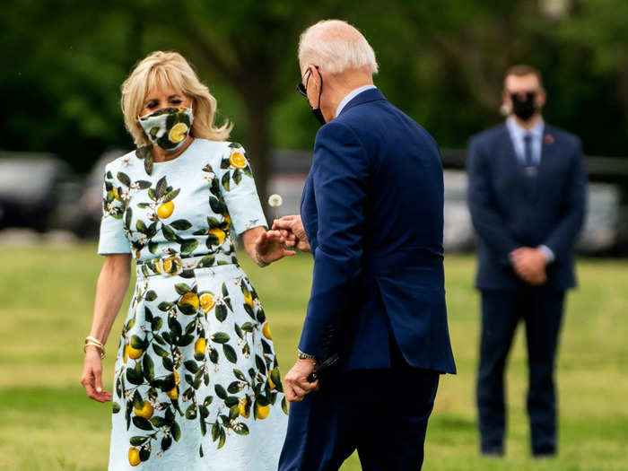 April 2021: Joe stopped to pick a dandelion for Jill on the White House lawn as they boarded Marine One.