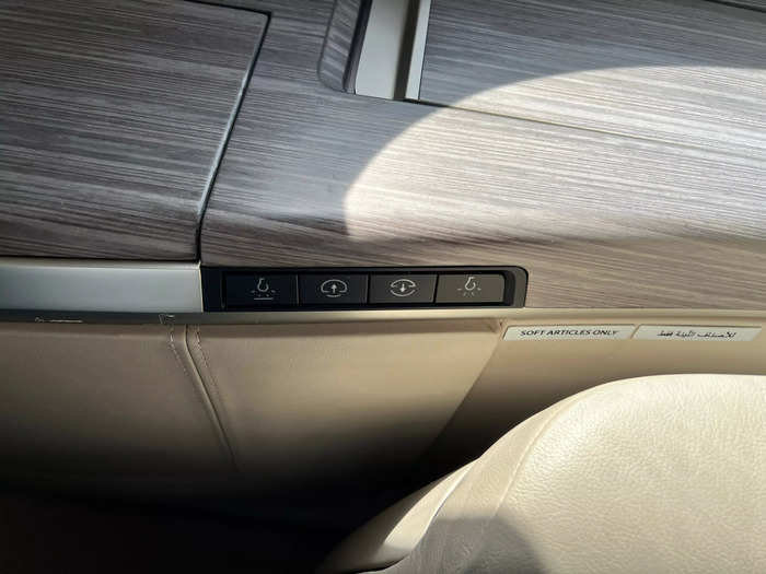 The lights and window shades can be controlled by buttons next to each seat.