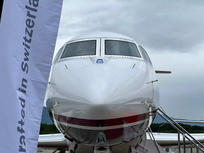 Underneath the cockpit window is the enhanced flight vision system, a camera that helps pilots land in low-visibility conditions. 