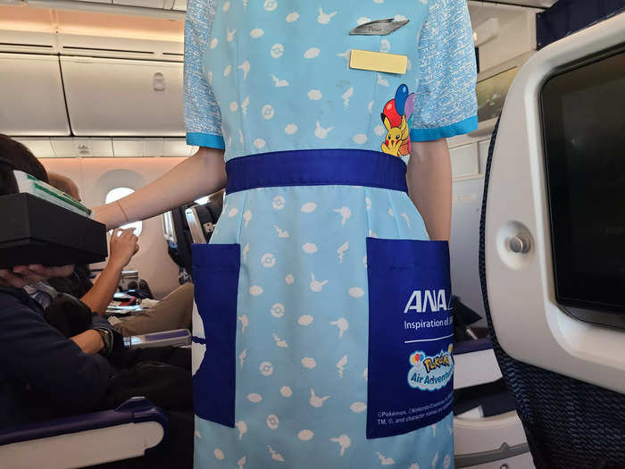 I was surprised that the flight attendants had themed uniform pieces.