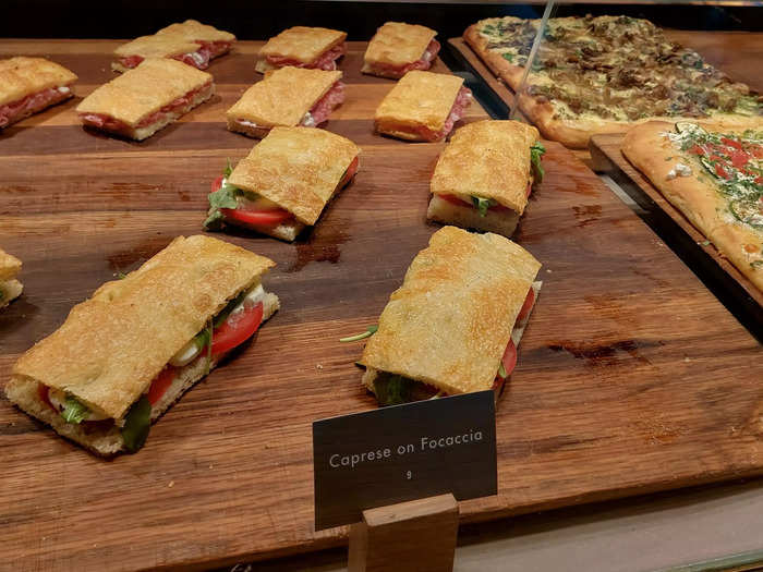 Savory items on the menu include pizza, focaccia sandwiches, and croissants with prosciutto and fontina cheese. Most are priced at just under $10 pre-tax.