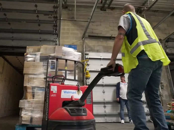 At the store, workers unload the trucks and restock the shelves