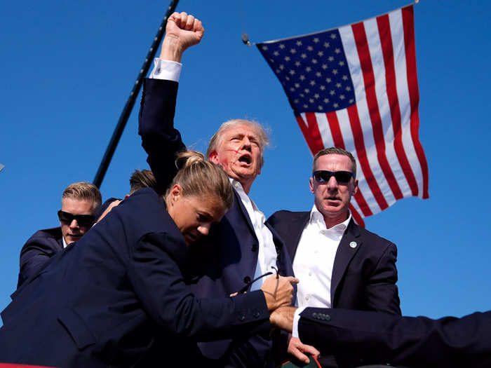 6:13 p.m. ET — Trump defiantly raised his fist and shouted 