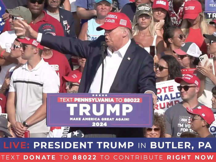 6:02 p.m. ET — Trump took the stage, waving to the crowd