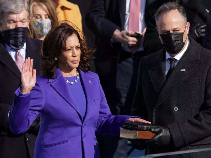 January 2021: Emhoff held two Bibles for Harris as she was sworn in as vice president.