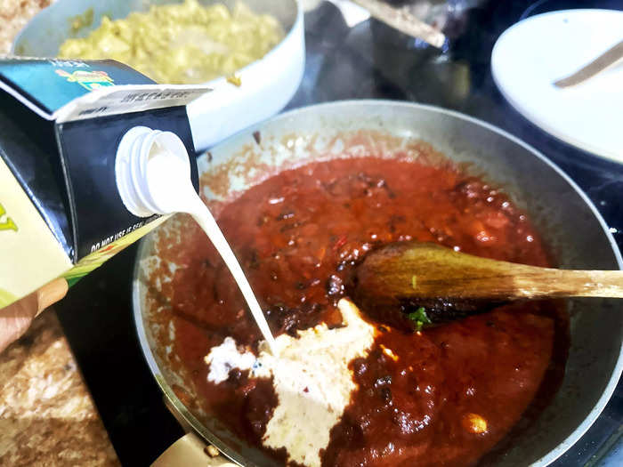 The mixture started to look more like butter chicken when I added tomato sauce. 