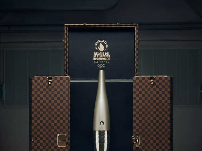 Custom Louis Vuitton trunks will hold medals and the torch.