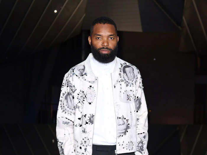 Artist Tavares Strachan wore a white jacket emblazoned with faces.