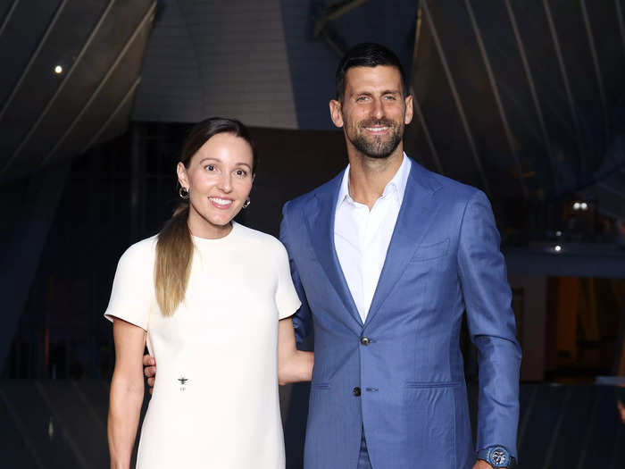 Tennis icon Novak Djokovic, who won a bronze medal for Serbia in 2008, wore a bright-blue suit. His wife, Jelena, wore a simple white shift dress.