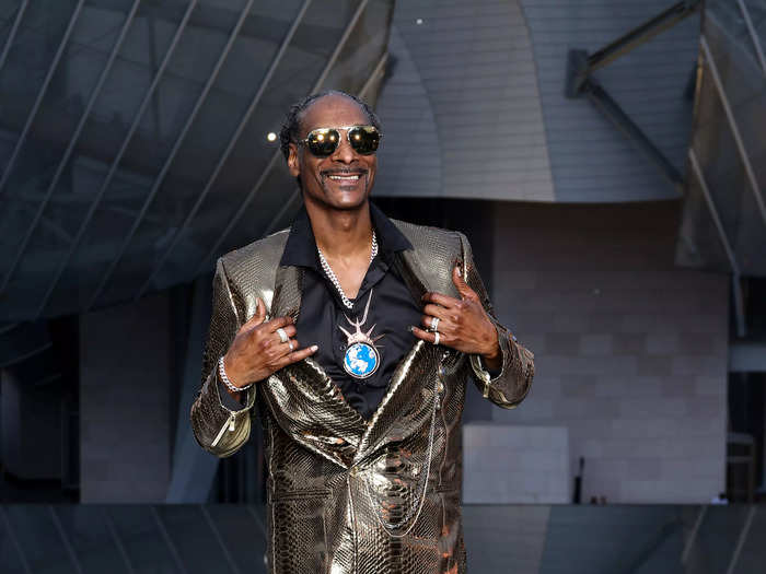 Snoop Dogg, an NBC correspondent for the Olympics, wore a snakeskin metallic jacket and matching metallic pants.