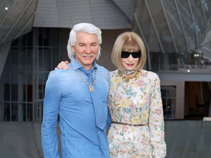 Baz Luhrmann wore a Canadian tuxedo to walk alongside Anna Wintour, who wore a crystal-covered floral dress.