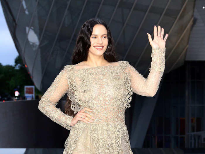 Rosalía wowed in this entirely see-through beige lace dress designed by Dior.