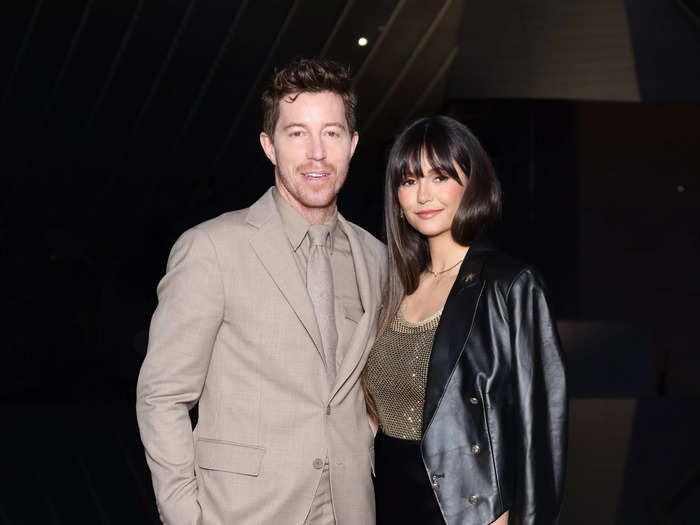 Former Olympic snowboarder Shaun White wore a monochromatic beige suit. His girlfriend, actor Nina Dobrev, wore a gold chain-mail top and a black silk skirt.