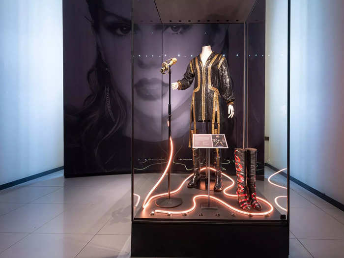 Next up is a stage costume from her 2018 "Reputation" tour, a snake-adorned microphone, and never-before-seen boots.