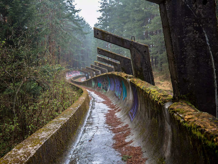 The bobsled course on Mount Trebević is overgrown and covered in graffiti.