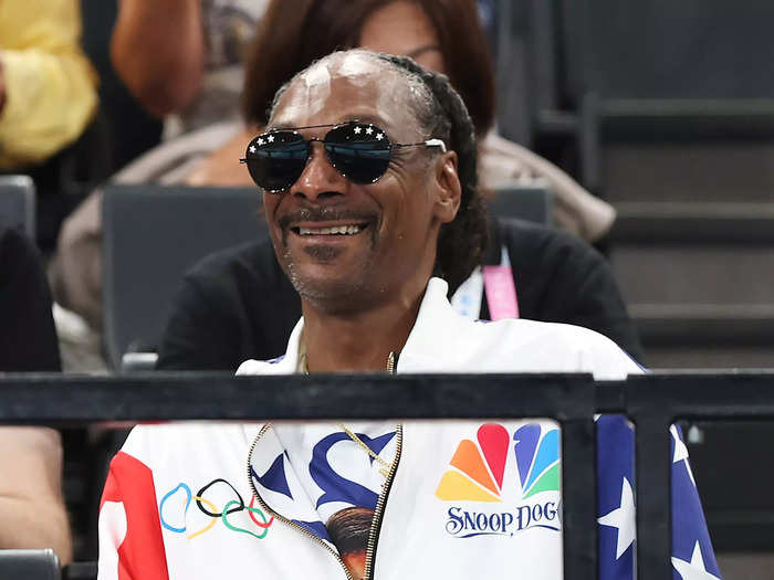 Snoop Dogg, who was one of the torchbearers,  was kitted out in a personalized shellsuit.