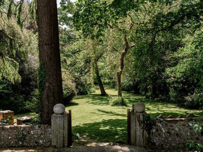 The stone terrace leads to a beautiful view of the grounds.