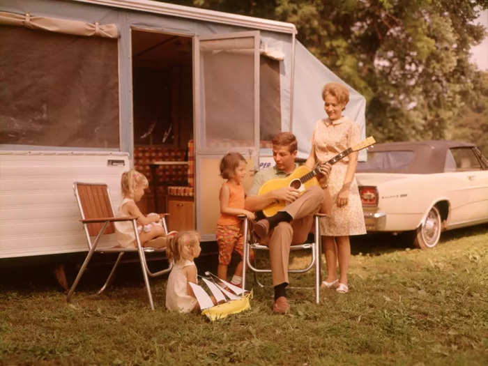 In order to haul around all the extra gear, and for somewhere to sleep, families often attached campers to their cars.