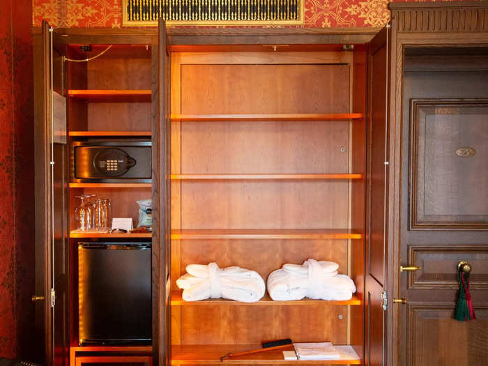 Inside the large closets, I discovered plush robes and a complimentary minibar. 