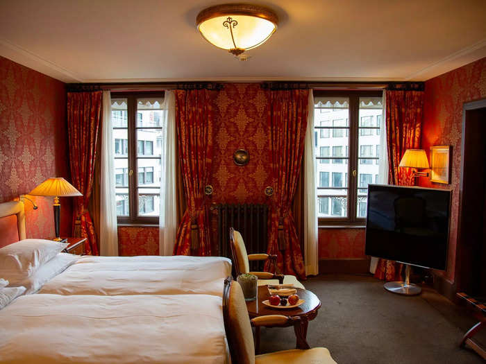 Dripping in red velvet curtains and rich wood, the room could simply be described as ornate. 