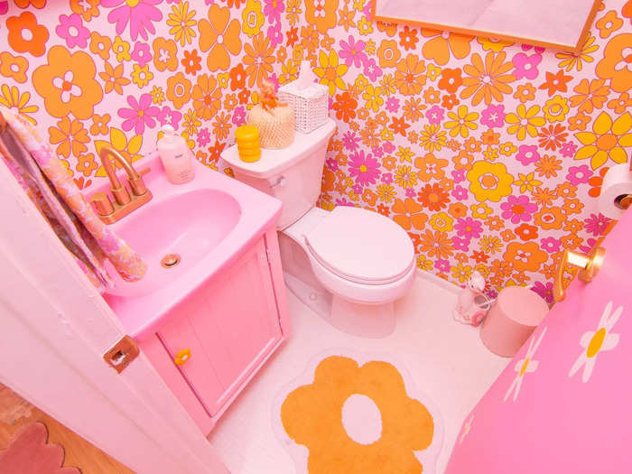 Instead of using wallpaper, Gabrielle hand-cut each of the flowers for her bathroom