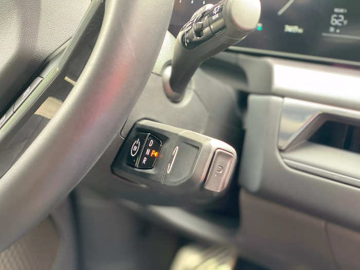 The shifter lives next to the steering wheel.