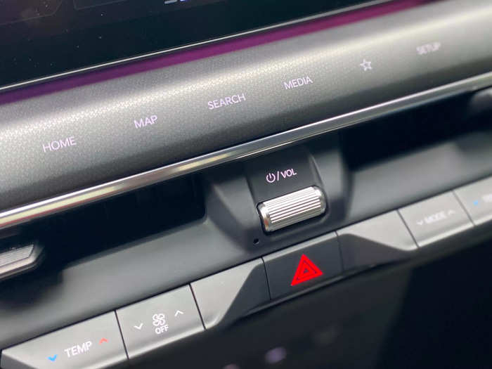 There are set of touch-sensitive buttons on the dash immediately below the screen.