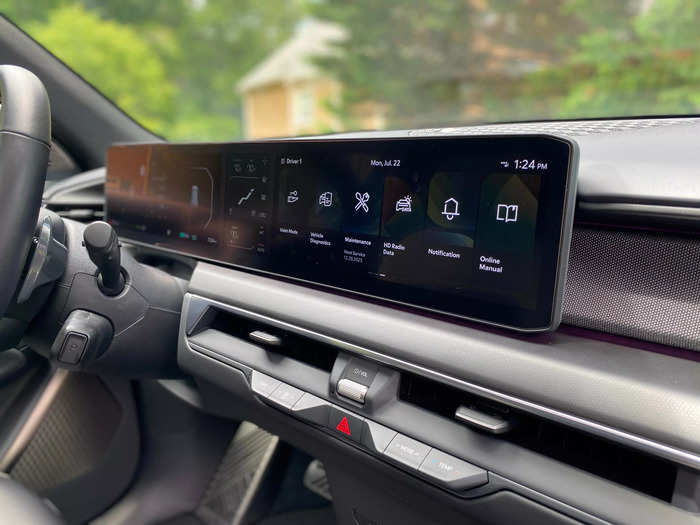 The centerpiece of the dash is a large screen that houses three separate displays.