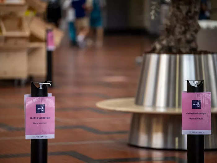 Bottles of hand sanitizer are stationed at the entrance of the dining hall.