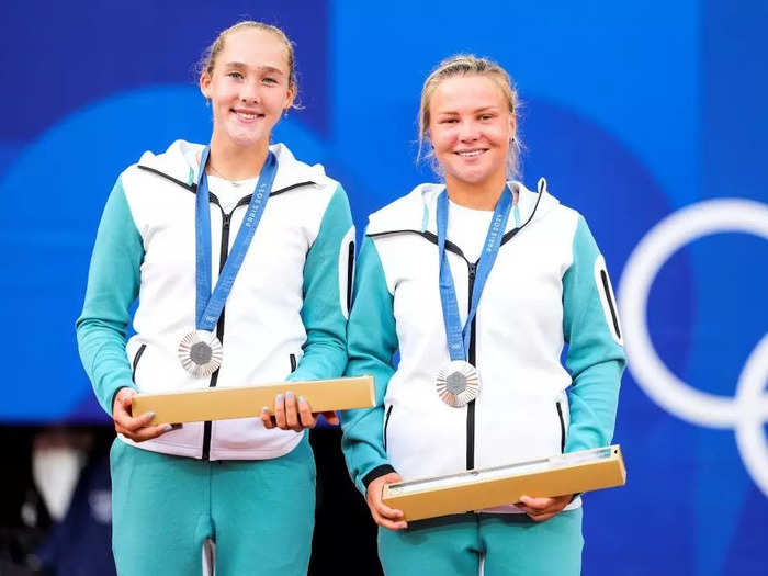 Athletes from Belarus and Russia competed as part of Team Individual Neutral Athletes wearing teal and white outfits.