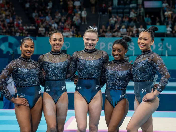 At the qualification event, their blue leotards featured red, white, blue, and gold crystals.