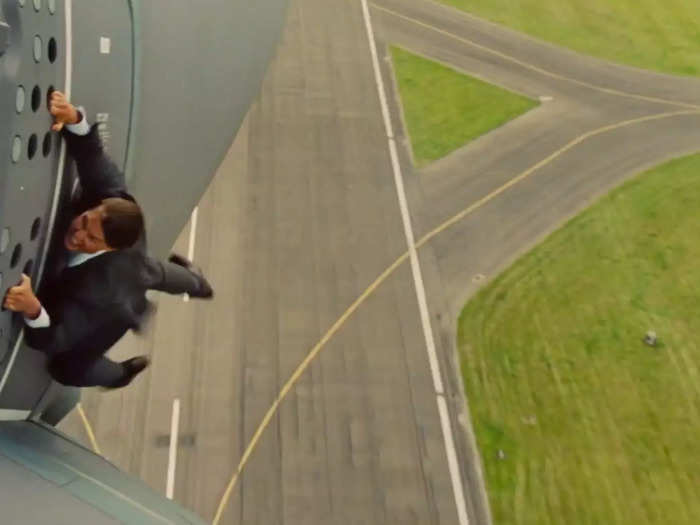 2. Cruise hung on the side of a plane as it took off for "Mission: Impossible — Rogue Nation."