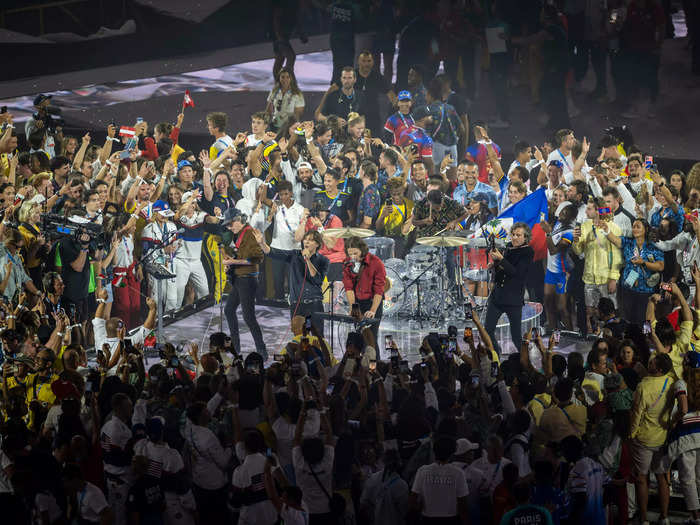 Athletes swarmed the stage as Phoenix performed.