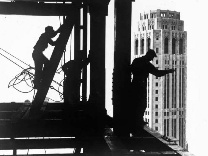 But while the skyscrapers were celebrated, the workers who helped build them toiled for long hours in dangerous conditions.