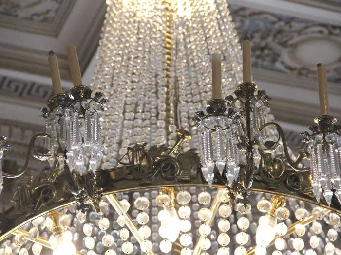 The crystal chandelier was decorated with musical instruments.