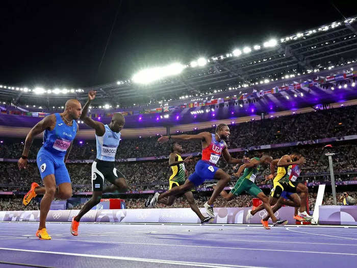 Spencer said this shot of Lyles crossing the finish line to win the gold medal was "premeditated."